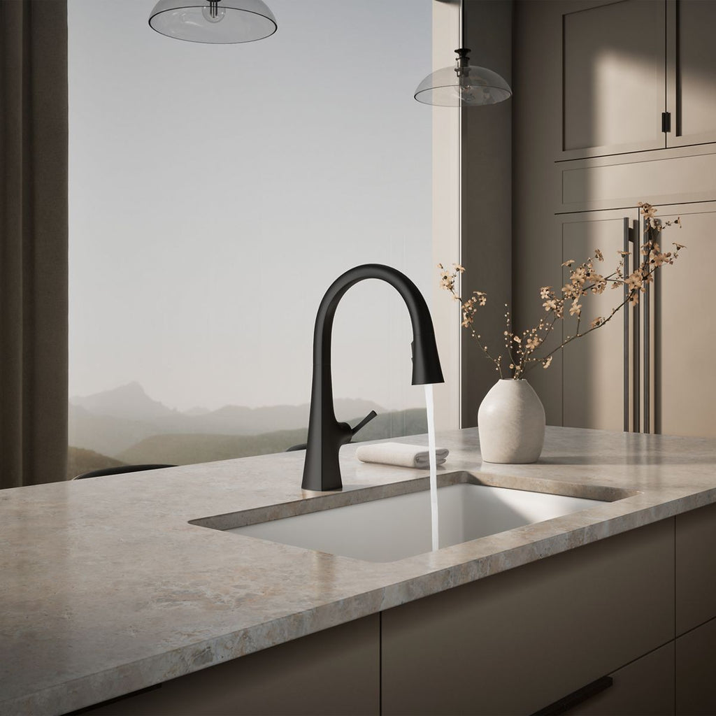 Graze Touchless pull-down kitchen sink faucet with three-function sprayhead, in use in a room setting, K-22068-BL
