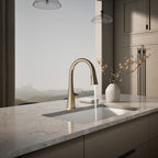 Graze Touchless pull-down kitchen sink faucet with three-function sprayhead, in use in a room setting, K-22068-BV