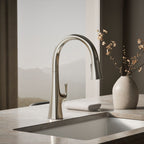 Graze Touchless pull-down kitchen sink faucet with three-function sprayhead, close-up in a room setting, K-22068-SN