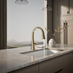Graze Touchless pull-down kitchen sink faucet with KOHLER Konnect and three-function sprayhead, in use in a room setting, K-22068-WB-AF