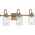 PROGRESS LIGHTING P300322-163 Vintage Brass Aiken Collection Three-Light Clear Glass Vintage Style Brass Farmhouse Style Bath Vanity Wall Light