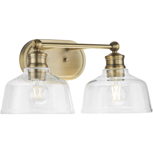 PROGRESS LIGHTING P300396-163 Vintage Brass Singleton Collection Two-Light 17" Vintage Brass Farmhouse Vanity Light with Clear Glass Shades