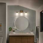 KICHLER 55112BNB Ciona 24" 3 Light Vanity Lighte With Round Ribbed Glass Brushed Natural Brass