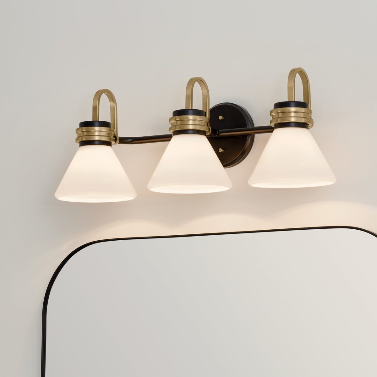 KICHLER 55155BK Farum 26 Inch 3 Light Vanity With Opal Glass In Black With Champagne Bronze