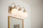 KICHLER 55151CPZ Hex 22.75 Inch 3 Light Vanity With Opal Glass In Champagne Bronze